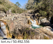 Cascata do Tahiti is also known as Fecha das Barjas and is a waterfall with several natural pools where you can swim. It is located in the Peneda Geres National Park in the north of Portugal. Стоковое фото, агентство Ingram Publishing / Фотобанк Лори
