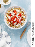 Dakos or koukouvagia salad. Classic recipe Cretan barley rusk salad with fresh tomato, mizithra cheese and oregano. Traditional mediterranean Greek cuisine. Healthy food, diet. Top view. Стоковое фото, агентство Ingram Publishing / Фотобанк Лори