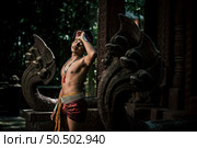 Portrait Handsome shirtless man in turban on head and beautiful silver ornament, The actor in Perform on legend love popular story, Thai Isan folktale called "Phadaeng and Nang-ai" in acient site. Стоковое фото, агентство Ingram Publishing / Фотобанк Лори