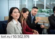 New business group person get serious about doing business, Even during the meeting’s break, they continued to analyze and exchange ideas. Стоковое фото, агентство Ingram Publishing / Фотобанк Лори
