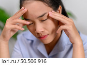 Female employee working and stressed at work. Стоковое фото, агентство Ingram Publishing / Фотобанк Лори