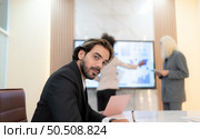 Group of young businessmen in international companies, Meeting to conclude a new responsible project. Стоковое фото, агентство Ingram Publishing / Фотобанк Лори