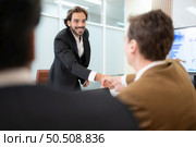 Group of young businessmen in international companies, Meeting to conclude a new responsible project. Стоковое фото, агентство Ingram Publishing / Фотобанк Лори