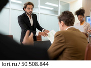 Group of young businessmen in international companies, Meeting to conclude a new responsible project. Стоковое фото, агентство Ingram Publishing / Фотобанк Лори
