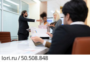 Group of young businessmen in international companies, Meeting to conclude a new responsible project. Стоковое фото, агентство Ingram Publishing / Фотобанк Лори