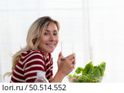 Young female with clean drinking water, which is important for her health, keeps her disease-free, and helps to brighten her skin. Стоковое фото, агентство Ingram Publishing / Фотобанк Лори