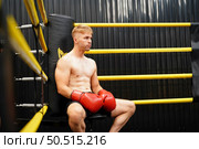 Muay Thai, The martial art of Thailand, Boxer sitting in the corner When the referee stops the fight in each round for the boxer to rest and the coach to introduce the fight in the next round. Стоковое фото, агентство Ingram Publishing / Фотобанк Лори