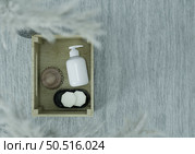 Pump bottle for cream or perfume on gray background. Стоковое фото, агентство Ingram Publishing / Фотобанк Лори