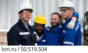 Working in a large industrial facility with heavy materials and machinery. Safety considerations are therefore of the utmost significance. Extreme vigilance must be exercised in this situation. Стоковое фото, агентство Ingram Publishing / Фотобанк Лори