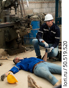 Working in a large industrial facility with heavy materials and machinery. Safety considerations are therefore of the utmost significance. Extreme vigilance must be exercised in this situation. Стоковое фото, агентство Ingram Publishing / Фотобанк Лори