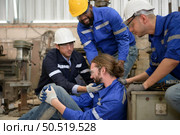 Working in a large industrial facility with heavy materials and machinery. Safety considerations are therefore of the utmost significance. Extreme vigilance must be exercised in this situation. Стоковое фото, агентство Ingram Publishing / Фотобанк Лори