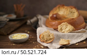 Fogaca on kitchen countertop with eggs and cinnamon sticks. Traditional cake from Santa Maria da Feira, Portugal. Стоковое фото, агентство Ingram Publishing / Фотобанк Лори