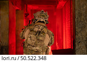 Soldier in anti-terrorist warfare in a dark building, Anti-terrorist operation training on the battlefield. Стоковое фото, агентство Ingram Publishing / Фотобанк Лори