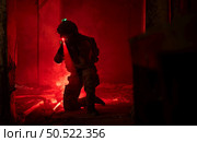 Soldier in anti-terrorist warfare in a dark building, Anti-terrorist operation training on the battlefield. Стоковое фото, агентство Ingram Publishing / Фотобанк Лори