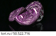 Red cabbage rotating over black background. Стоковое фото, агентство Ingram Publishing / Фотобанк Лори
