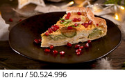 Homemade vegetable quiche with goat cheese, brussels sprouts and pomegranate seeds. Стоковое фото, агентство Ingram Publishing / Фотобанк Лори