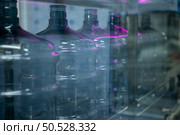 Bottles are sterilized before being transferred to the water filling line. Стоковое фото, агентство Ingram Publishing / Фотобанк Лори