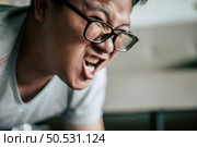 Funny overweight man in glasses try to planking on the floor doing workout, copy space. Стоковое фото, агентство Ingram Publishing / Фотобанк Лори
