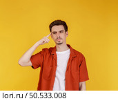 Portrait of thinking man surrounded by question mark on isolated background. Finding inspiration or solution to problem. Стоковое фото, агентство Ingram Publishing / Фотобанк Лори