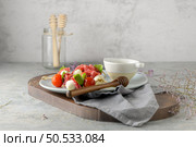 Italian style appetizer, antipasto skewer or caprese on a stick with basil, salami, mozarella and tomatoes. Стоковое фото, агентство Ingram Publishing / Фотобанк Лори