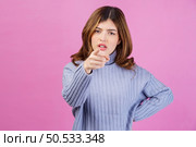 Portrait of angry sad young woman looking and pointing finger at camera isolated over pink background. People lifestyle and emotion concept. Стоковое фото, агентство Ingram Publishing / Фотобанк Лори