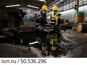 Scientists and government officials Inspect and collect chemical leak samples in industrial sites. to be thoroughly investigated in the laboratory. Стоковое фото, агентство Ingram Publishing / Фотобанк Лори