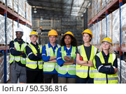Portrait of worker in an auto parts warehouse, Relax after examine auto parts that are ready to be shipped to the automobile assembly factory. Стоковое фото, агентство Ingram Publishing / Фотобанк Лори