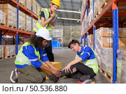 Working in a large industrial facility with heavy materials and machinery. Safety considerations are therefore of the utmost significance. Extreme vigilance must be exercised in this situation. Стоковое фото, агентство Ingram Publishing / Фотобанк Лори