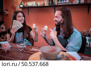 Two young entrepreneurs who own a pottery business. generate enough income from the business to expand the business to accommodate the increasing number of customers. Стоковое фото, агентство Ingram Publishing / Фотобанк Лори