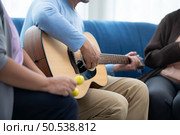 Old people’s companions To unwind during the weekend, gather together for activities like singing, playing the guitar, and chit-chatting. Стоковое фото, агентство Ingram Publishing / Фотобанк Лори