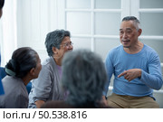 Old people’s companions To unwind during the weekend, gather together for activities like singing, playing the guitar, and chit-chatting. Стоковое фото, агентство Ingram Publishing / Фотобанк Лори
