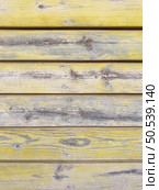 Yellow painted old wooden wall. Yellow background. Стоковое фото, агентство Ingram Publishing / Фотобанк Лори