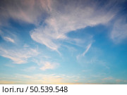 Mountain range and white clouds in blue sky at day. View from above air plane. Стоковое фото, агентство Ingram Publishing / Фотобанк Лори