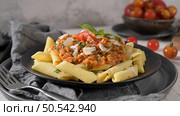 Vegetarian lentil Bolognese sauce penne pasta on a dark background. Healthy eating concept. Стоковое фото, агентство Ingram Publishing / Фотобанк Лори