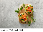 Salmon sandwiches with cream cheese, fresh romaine lettuce and cucumber, top down view. Стоковое фото, агентство Ingram Publishing / Фотобанк Лори