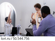 Group of multi-national team of architects and designers is meeting to brainstorm designs for wind turbines to capture wind energy and convert it into electrical energy. Стоковое фото, агентство Ingram Publishing / Фотобанк Лори