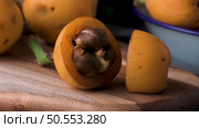 loquats on kitchen counter background. Стоковое фото, агентство Ingram Publishing / Фотобанк Лори