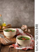 Caldo verde popular soup in Portuguese cuisine. traditional ingredients for caldo verde are potatoes, collard greens , olive oil and salt. Additionally garlic or onion may be added. Стоковое фото, агентство Ingram Publishing / Фотобанк Лори