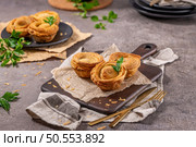 Pastries filled with meat, traditionally baked in black clay molds both from the region on Vila Real, Portugal. Стоковое фото, агентство Ingram Publishing / Фотобанк Лори