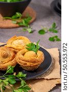 Pastries filled with meat, traditionally baked in black clay molds both from the region on Vila Real, Portugal. Стоковое фото, агентство Ingram Publishing / Фотобанк Лори
