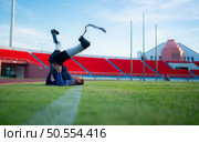Athletes with disabilities take a break at the stadium between training sessions. Стоковое фото, агентство Ingram Publishing / Фотобанк Лори