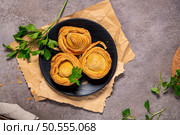 Pastries filled with meat, traditionally baked in black clay molds both from the region on Vila Real, Portugal. Стоковое фото, агентство Ingram Publishing / Фотобанк Лори