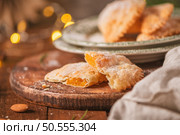 A crescent-shaped pastry whose filling is made of eggs and almonds wrapped in crispy dough, cut in an artisanal way and sprinkled with sugar. Стоковое фото, агентство Ingram Publishing / Фотобанк Лори