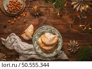 A crescent-shaped pastry whose filling is made of eggs and almonds wrapped in crispy dough, cut in an artisanal way and sprinkled with sugar. Стоковое фото, агентство Ingram Publishing / Фотобанк Лори