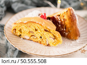 Bolo do Rei or King’s Cake, Made for Christmas, Carnavale or Mardi Gras with Christmas season elements in Background. Стоковое фото, агентство Ingram Publishing / Фотобанк Лори