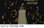 Glass of champagne with splash, isolated on black background. Стоковое фото, агентство Ingram Publishing / Фотобанк Лори