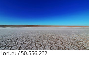 Dry lake or swamp in the process of drought and lack of rain or moisture, a global natural disaster - aerial drone view. Стоковое фото, агентство Ingram Publishing / Фотобанк Лори