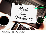 Meet Your Deadlines is written on white piece of paper. Deadlines Agenda Appointment Assignment To Do Concept. Стоковое фото, агентство Ingram Publishing / Фотобанк Лори