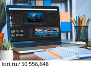 Content creator editing video montage on film production software, using laptop to learn for online class course. Student working on movie making development, creating multimedia footage. Стоковое фото, агентство Ingram Publishing / Фотобанк Лори