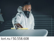 Surfboard manufacturing, Shaper working on board details. Concept of industrial manufacturing, qualified professional, occupation and employment. Стоковое фото, агентство Ingram Publishing / Фотобанк Лори